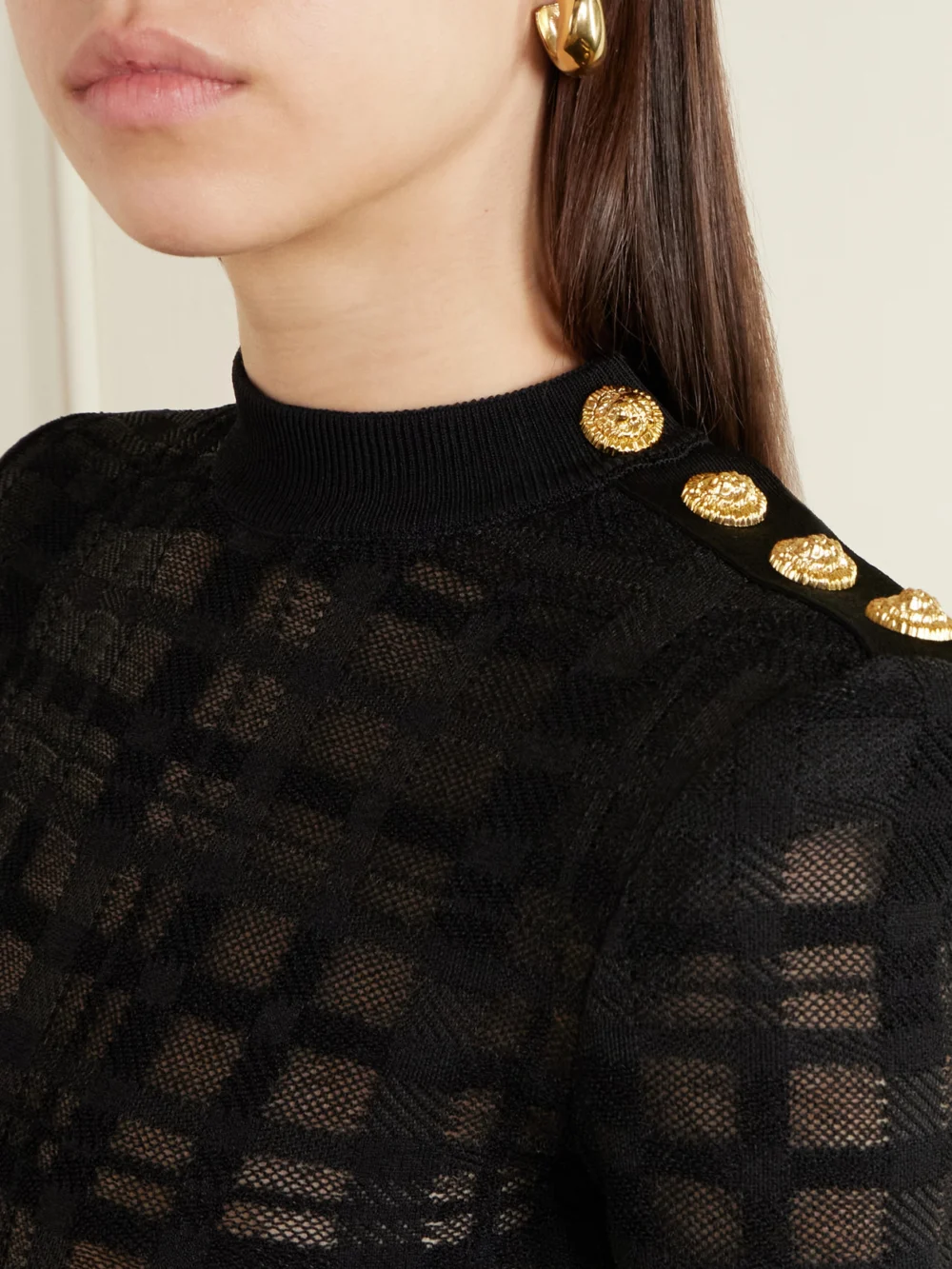 Close-up detail of the Balmain Embellished Checked Stretch-knit Bodysuit
