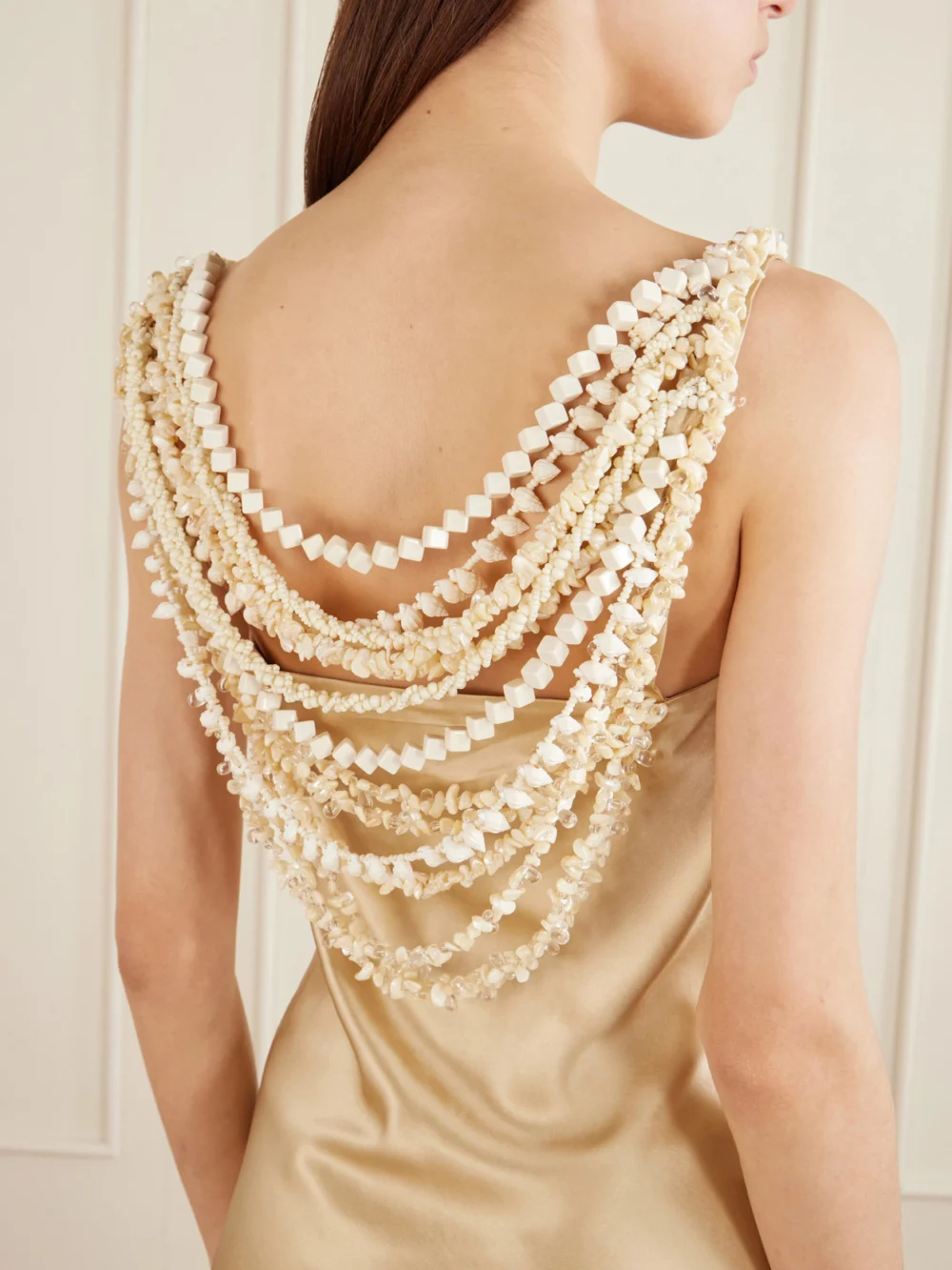 Close-up detail of the Balmain Embellished Draped Silk-satin Mini Dress