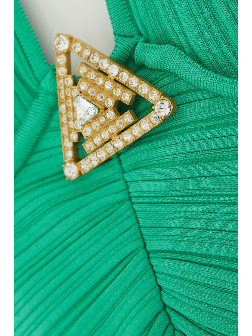 Close-up detail of the Balmain Embellished Halterneck Plissé-knitted Gown