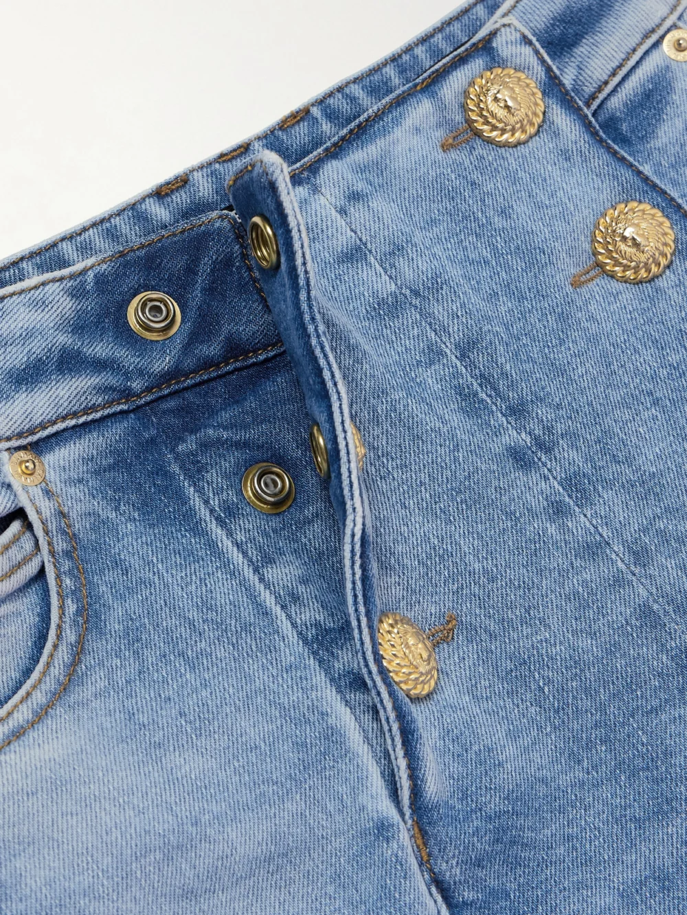 Close-up detail of the Balmain Embellished Paneled High-rise Skinny Jeans