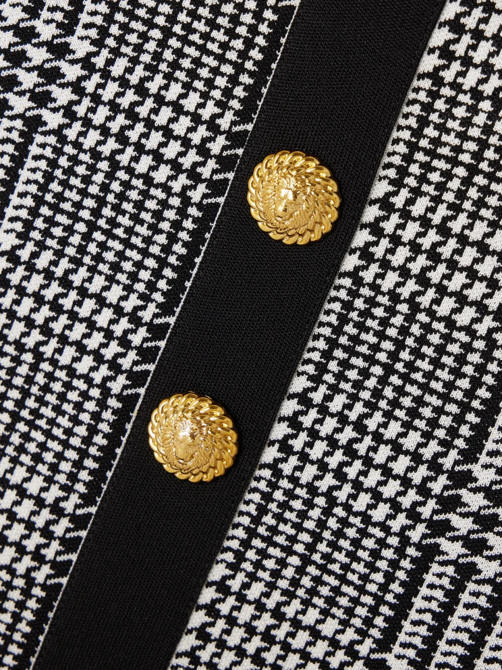 Close-up detail of the Balmain Embellished Prince of Wales Checked Stretch-knit Bodysuit
