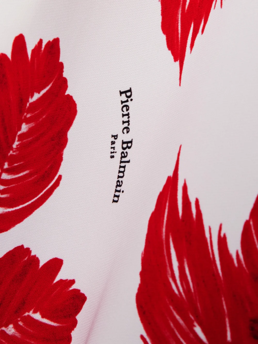 Close-up detail of the Balmain Floral-print Crepe Flared Pants
