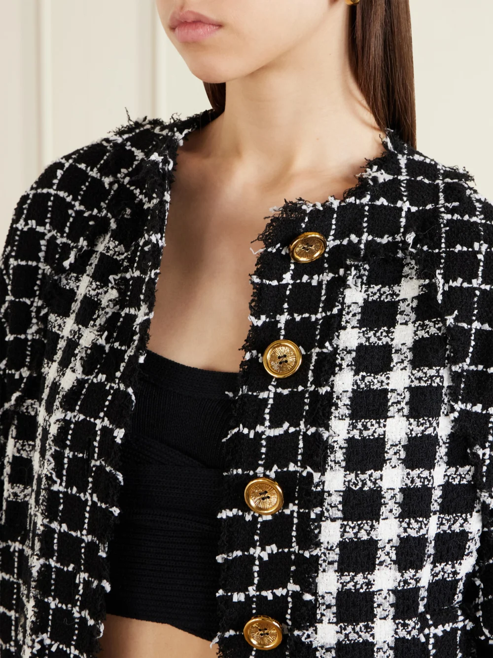 Close-up detail of the Balmain Frayed Checked Bouclé-tweed Bomber Jacket