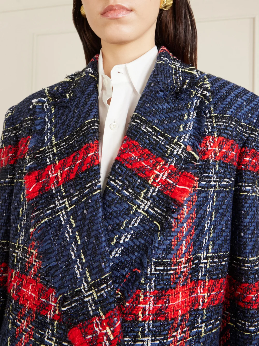 Close-up detail of the Balmain Fringed Checked Tweed Jacket