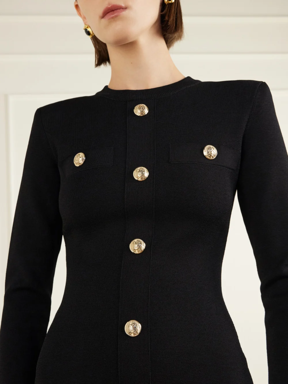 Close-up detail of the Balmain Knitted Mini Dress