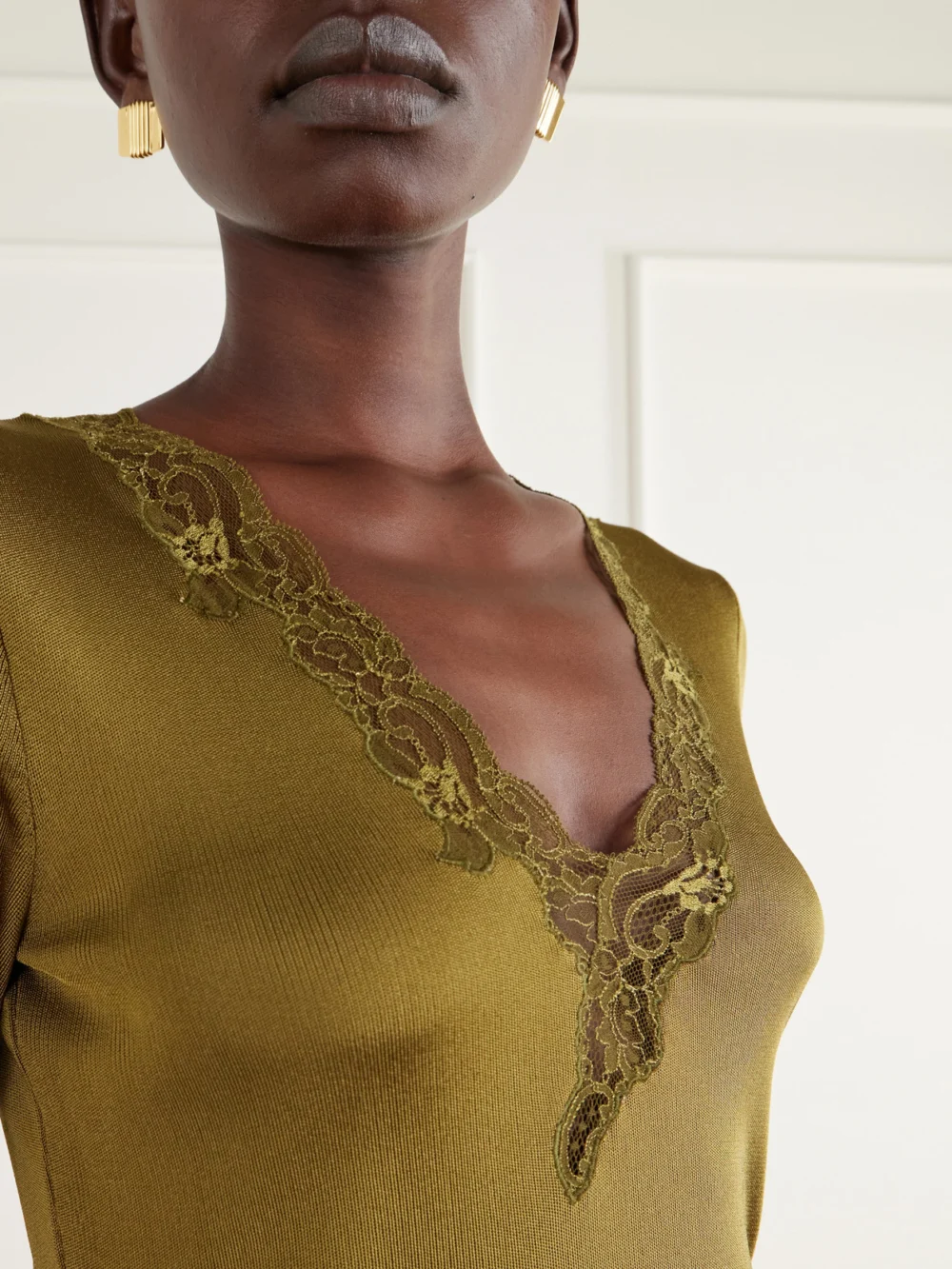 Close-up detail of the Balmain Lace-trimmed Knitted T-shirt