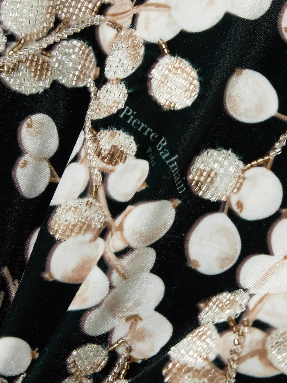 Close-up detail of the Balmain Open-back Embellished Printed Velvet Mini Dress