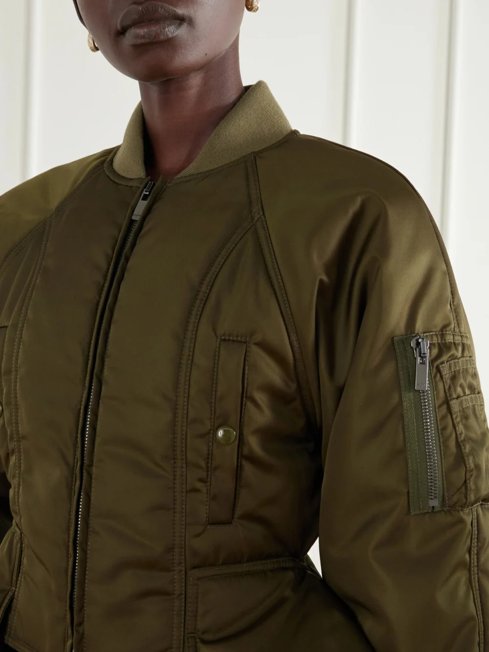 Close-up detail of the Balmain Paneled Cropped Satin Jacket