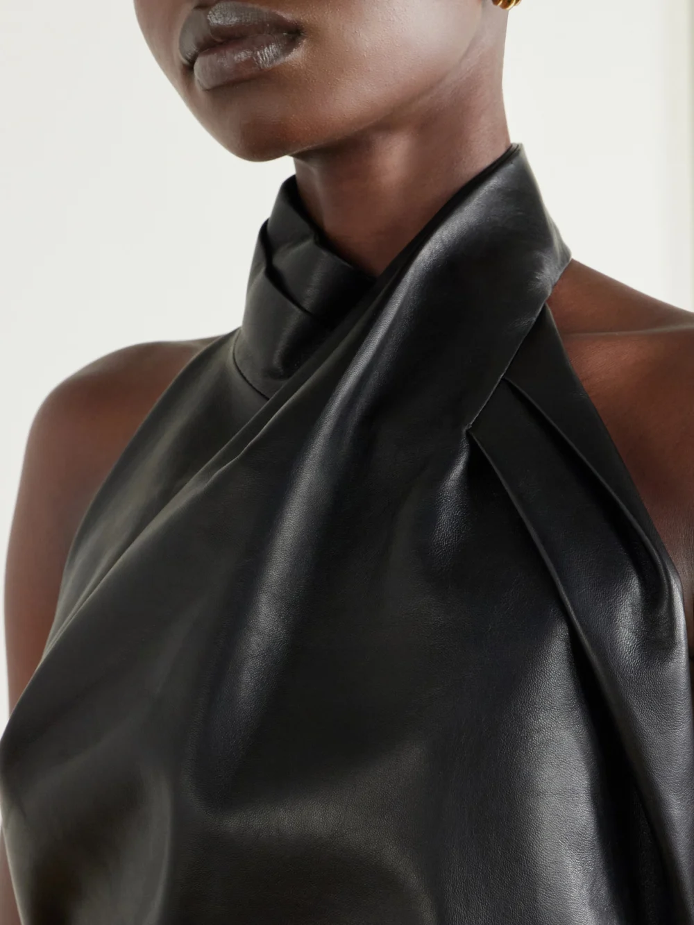 Close-up detail of the Balmain Paneled Halterneck Leather Mini Dress