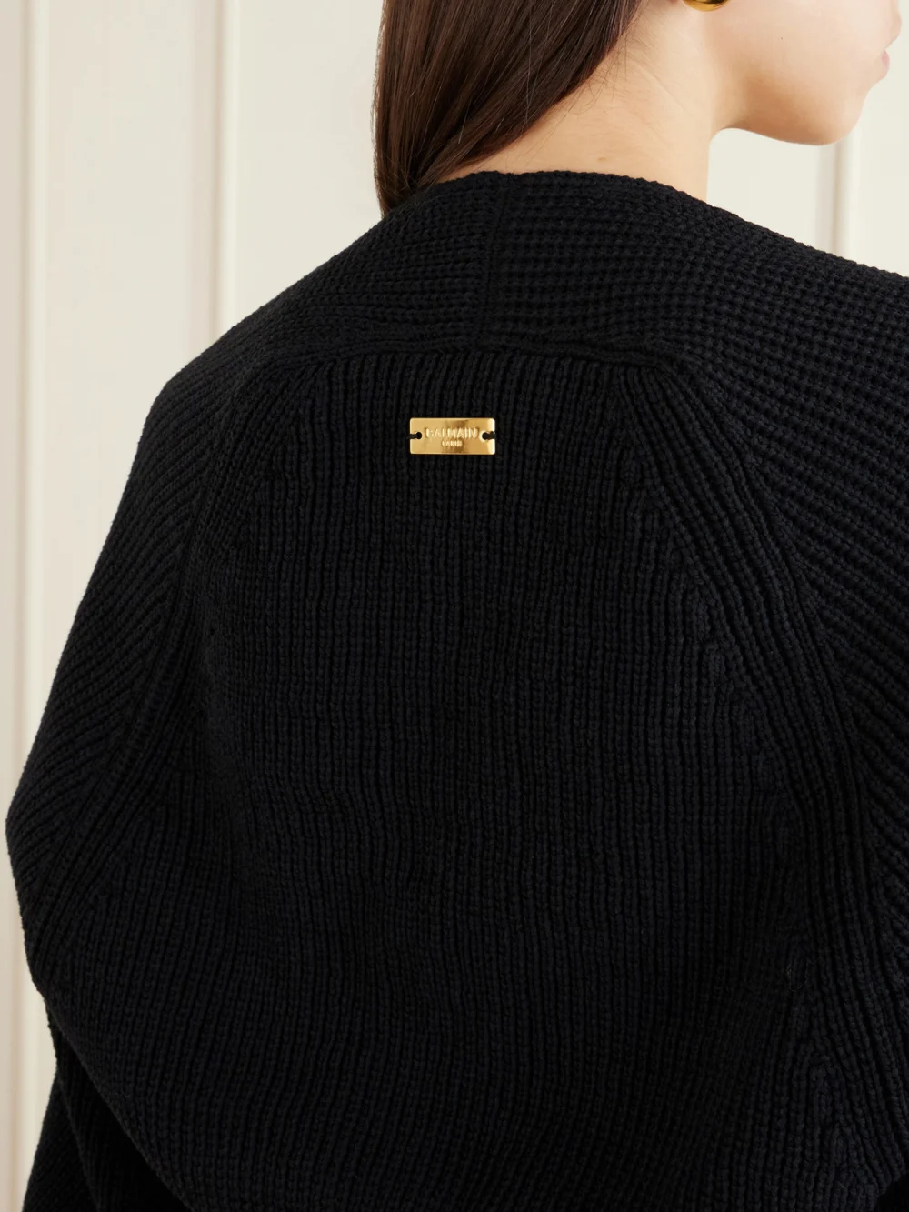 Close-up detail of the Balmain Ribbed-knit Cardigan