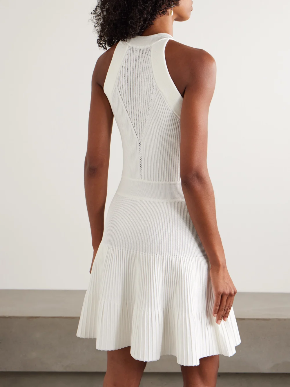 Back view of the Balmain Ribbed Pointelle-knit Mini Dress