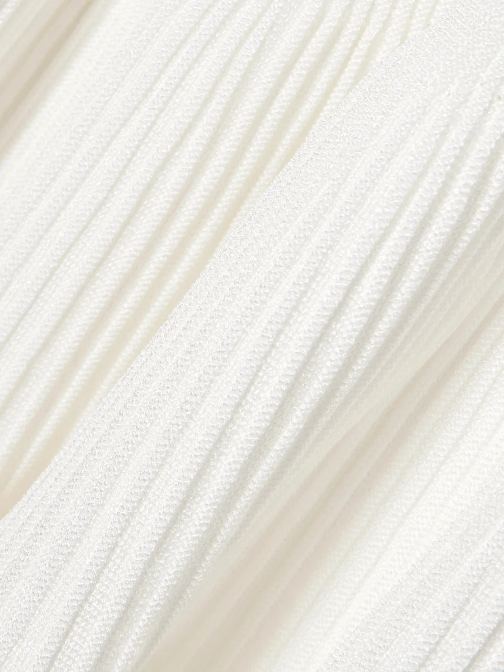 Close-up detail of the Balmain Ribbed Pointelle-knit Mini Dress