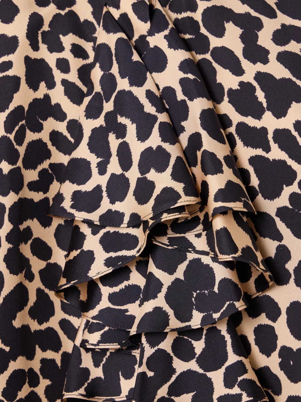 Close-up detail of the Balmain Ruffled Leopard-print Silk Blouse