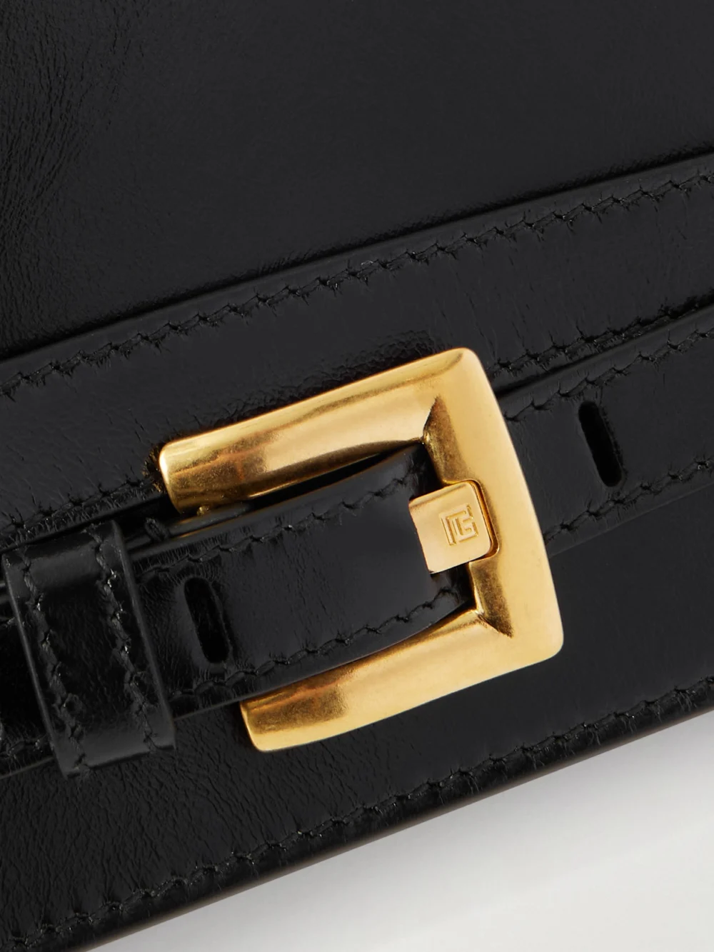 Close-up detail of the Balmain Shuffle Buckled Leather Shoulder Bag