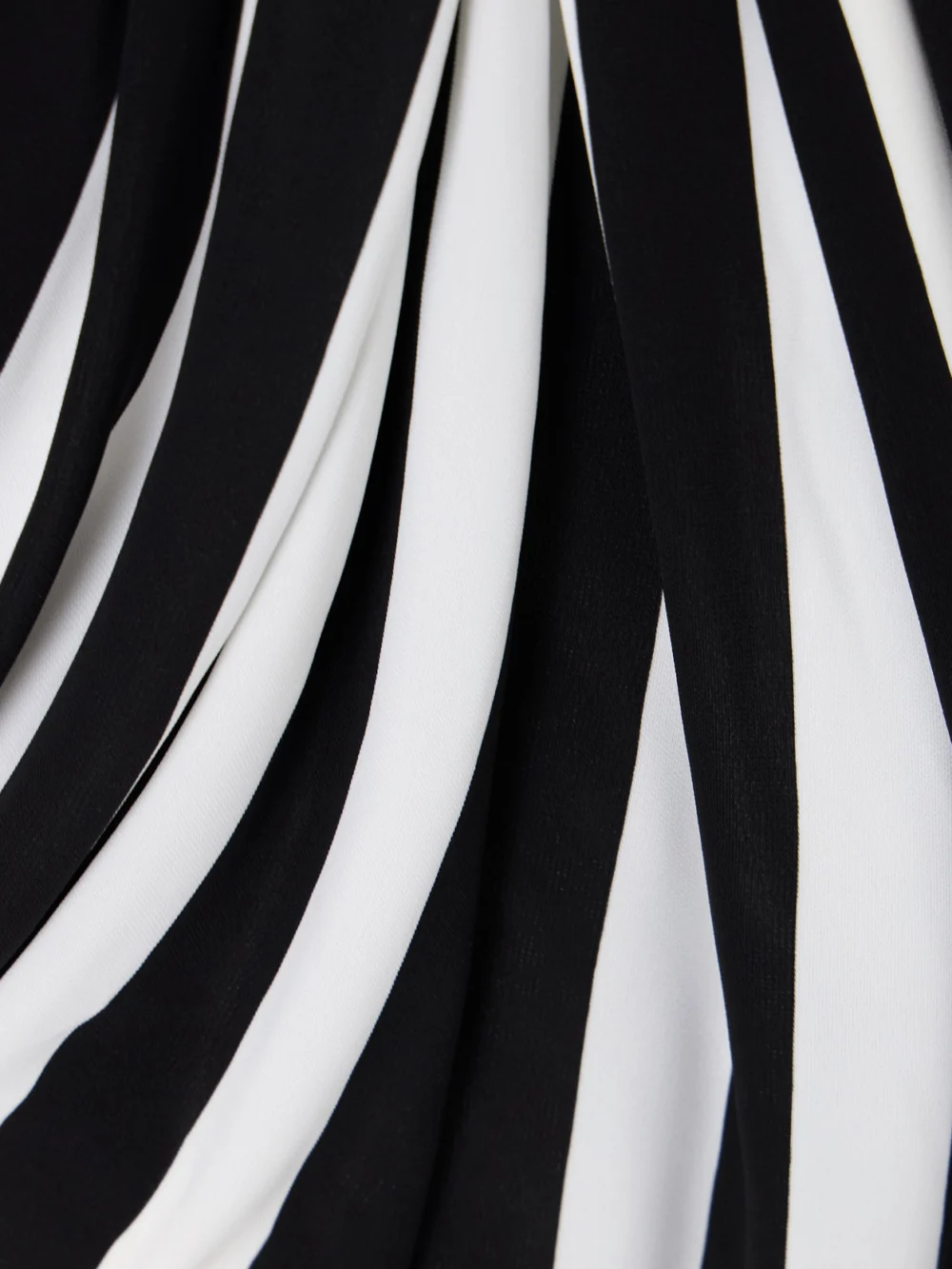 Close-up detail of the Balmain Strapless Asymmetric Draped Striped Jersey Gown