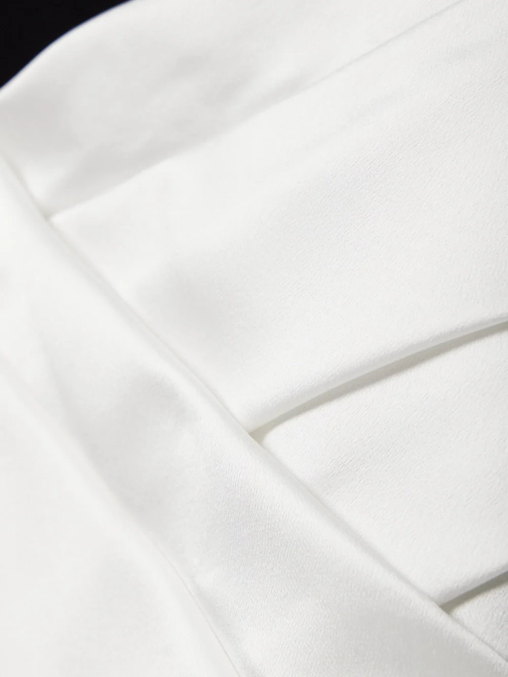 Close-up detail of the Balmain Two-tone Asymmetric Crepe and Pleated Satin Mini Dress