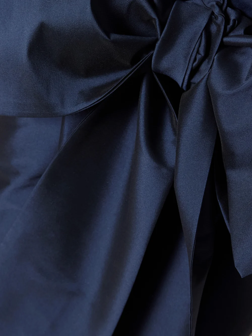 Close-up detail of the Bernadette Beatrice Belted Satin and Taffeta Gown
