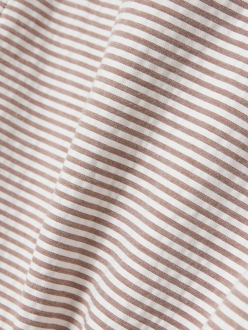 Close-up detail of the Bernadette Cara Off-the-shoulder Gathered Striped Cotton-seersucker Midi Dress