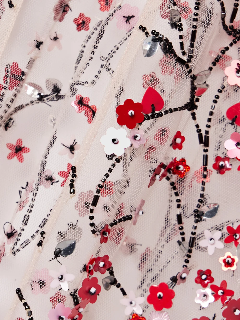 Close-up detail of the Bernadette Christelle Hooded Embellished Tulle Cape