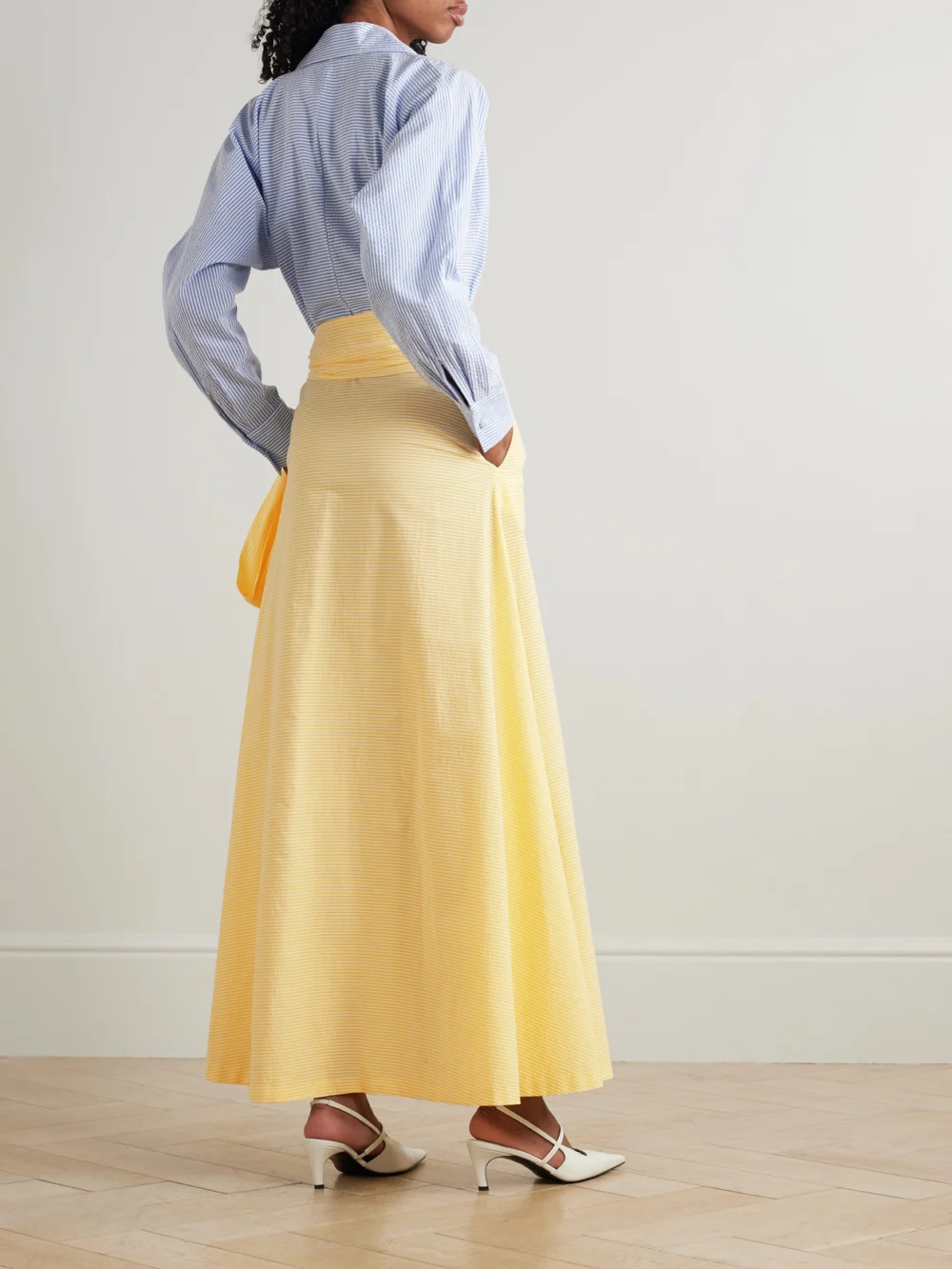 Back view of the Bernadette Clarence Belted Striped Cotton-seersucker Maxi Shirt Dress