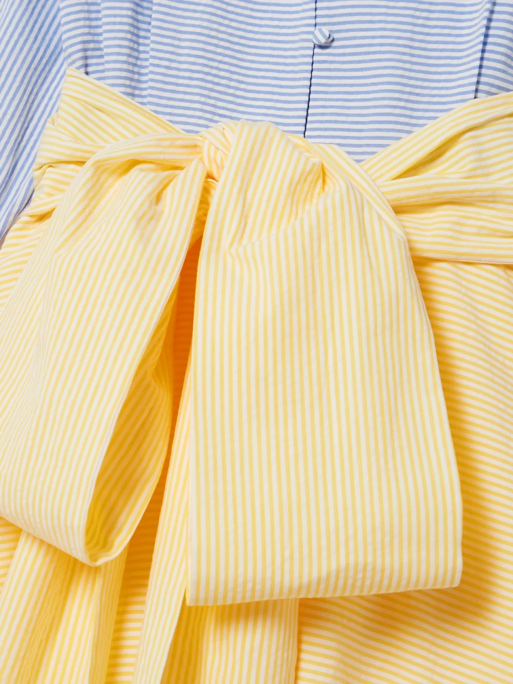 Close-up detail of the Bernadette Clarence Belted Striped Cotton-seersucker Maxi Shirt Dress