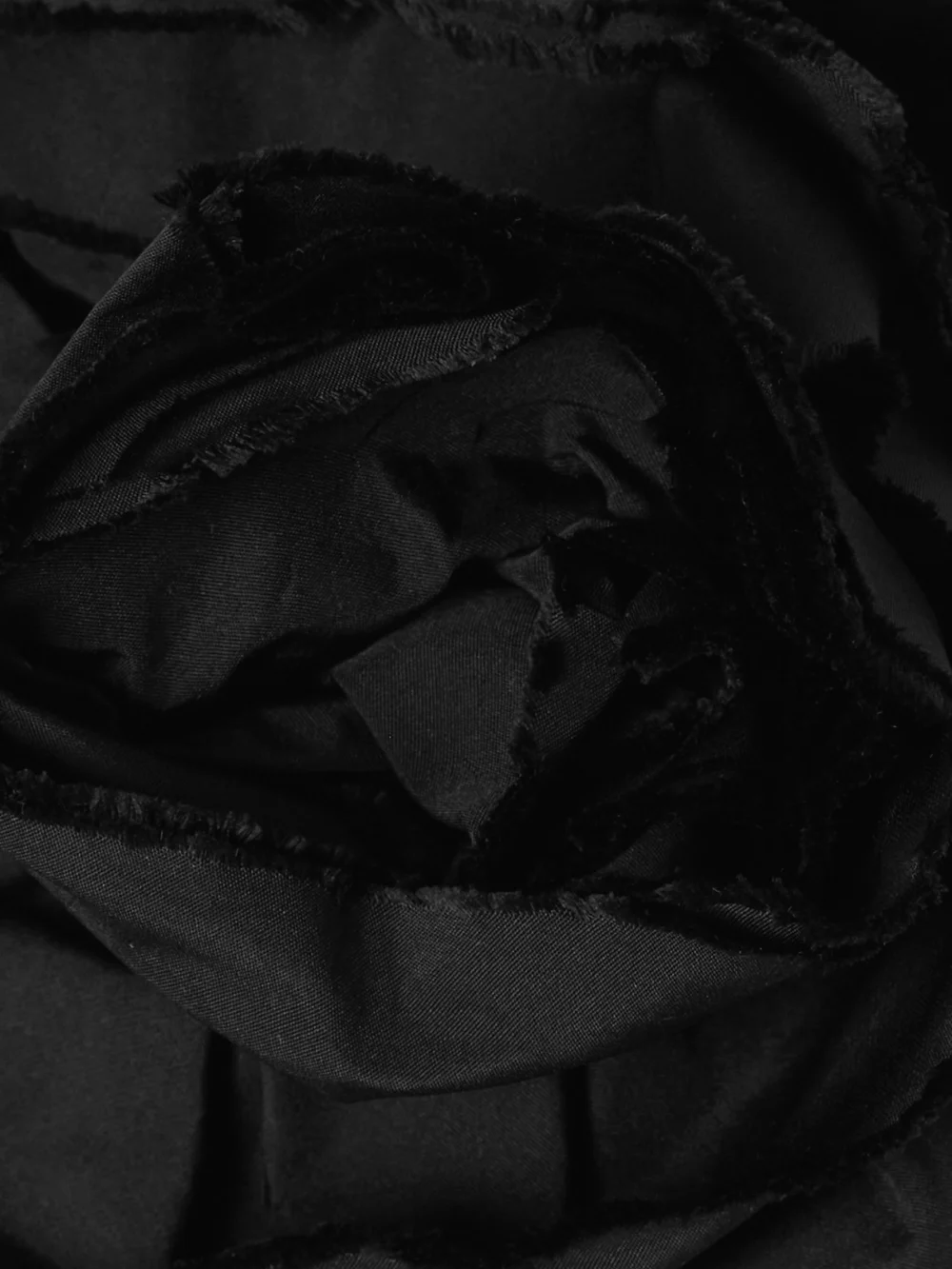 Close-up detail of the Bernadette Lena Cropped Appliquéd Taffeta Bustier Top