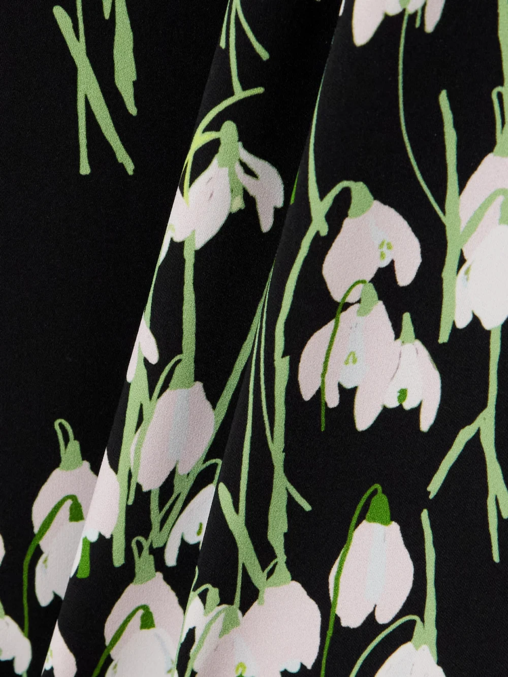 Close-up detail of the Bernadette Lucille Belted Floral-print Crepe Midi Dress
