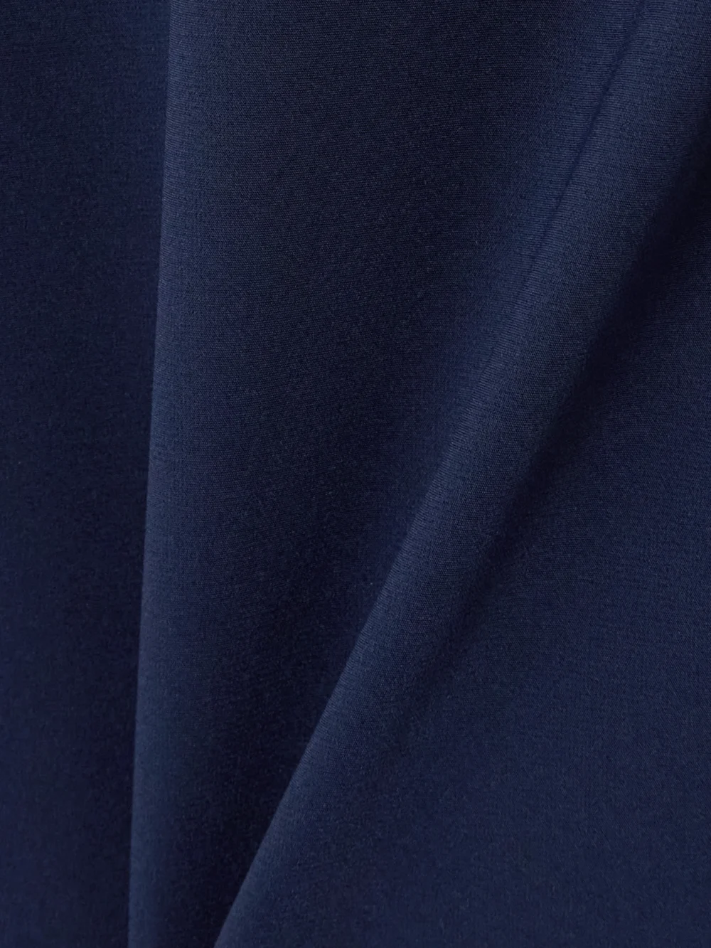 Close-up detail of the Bernadette Phil Bow-embellished Crepe Gown