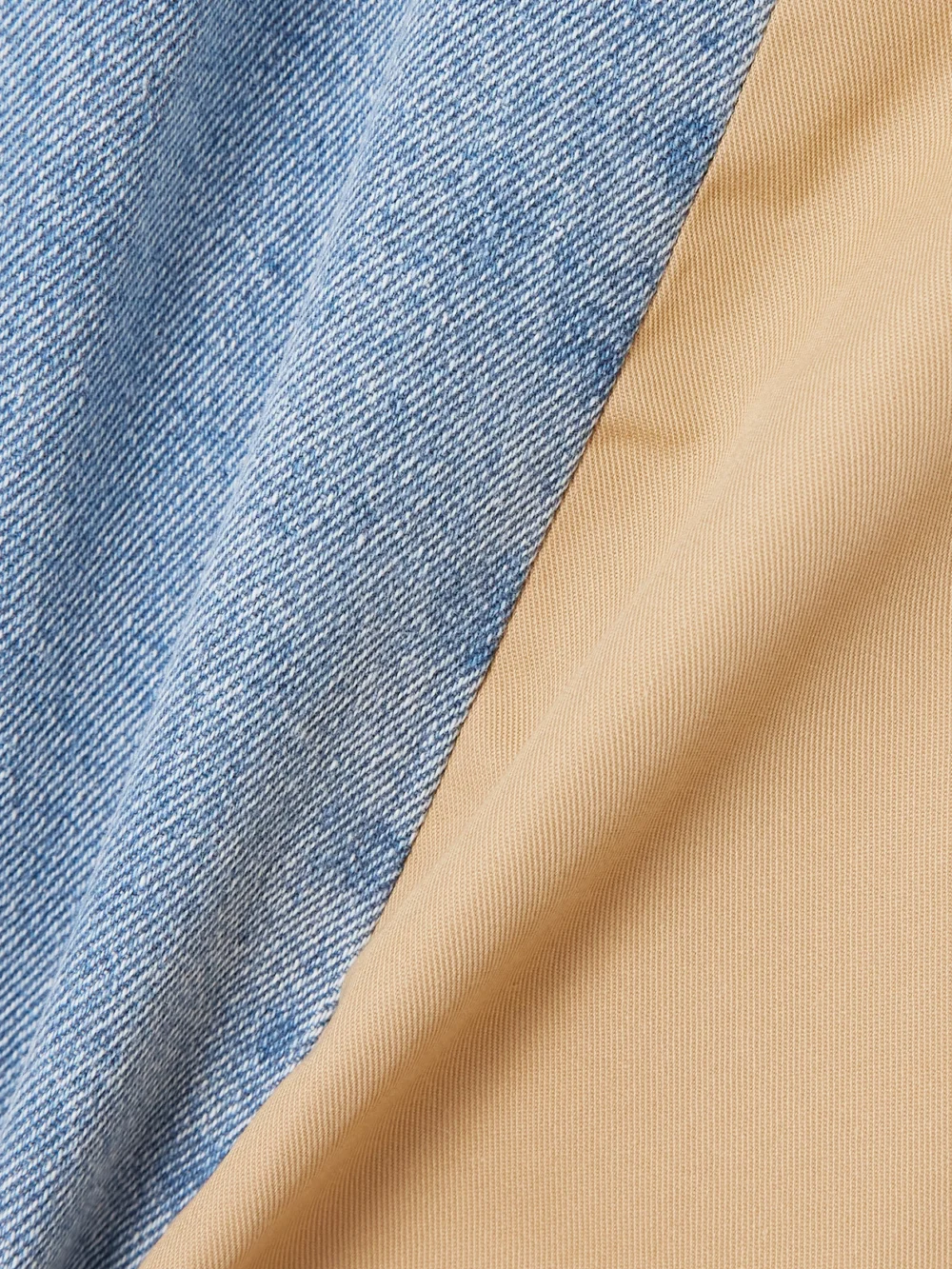 Close-up detail of the Bettter Denibermuda Pleated Cotton-gabardine and Denim Shorts