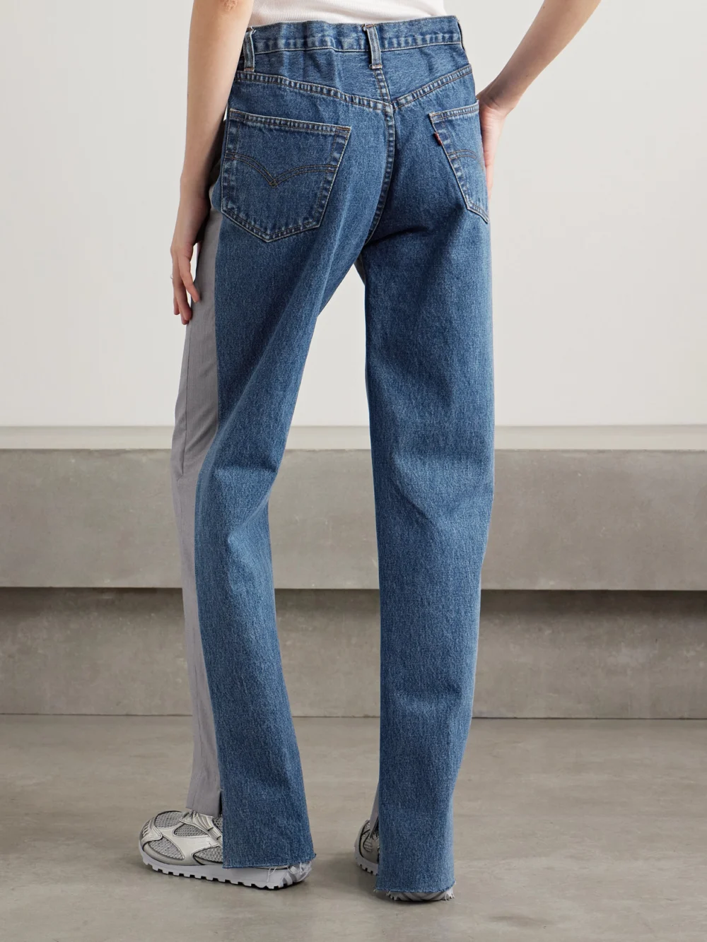 Back view of the Bettter Denitrouser Paneled Pleated Wool-blend and Denim Pants