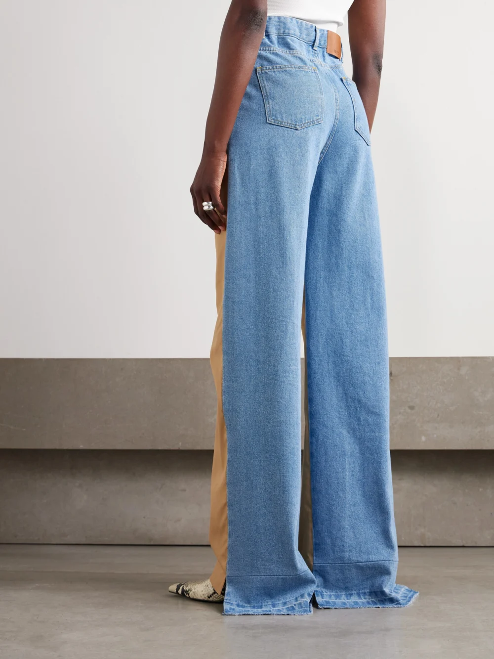 Back view of the Bettter Denitrouser Pleated Cotton-twill and Denim Straight-leg Pants