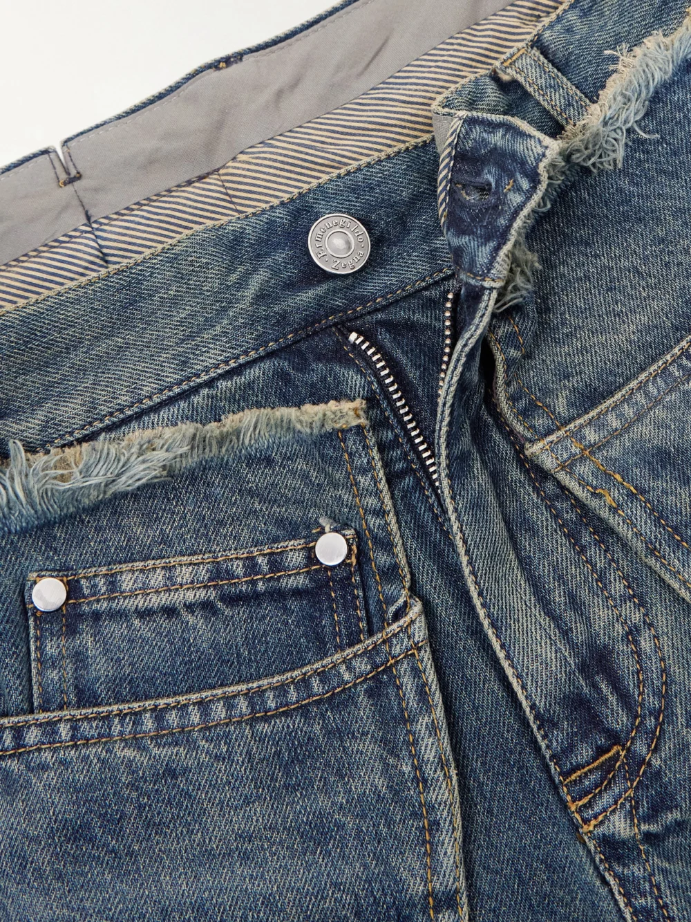 Close-up detail of the Bettter Wrap-effect Frayed Mid-rise Straight-leg Jeans