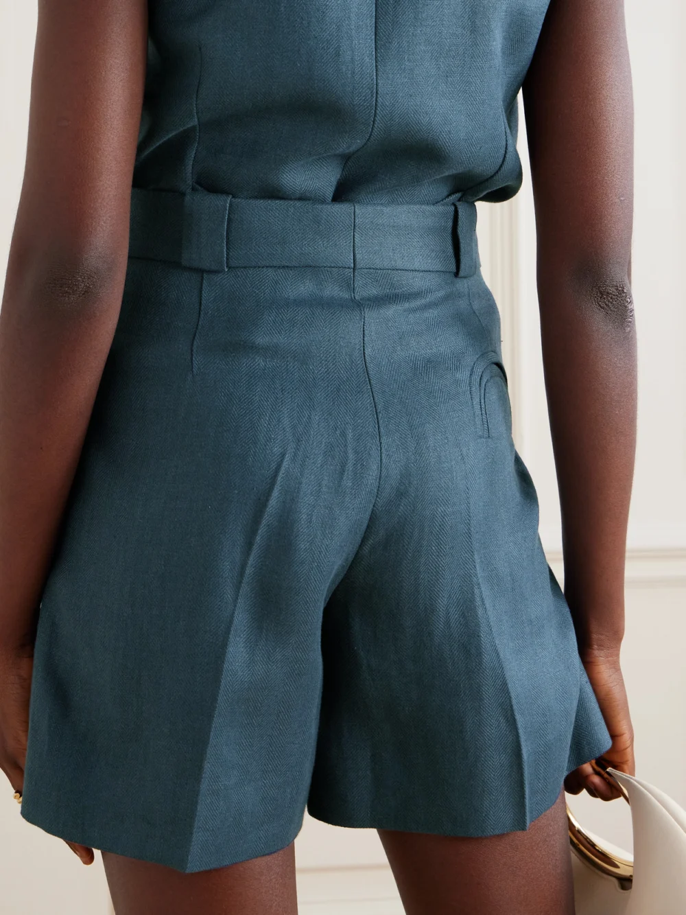Back view of the BLAZÉ Milano Clarity Pleated Herringbone Linen Shorts