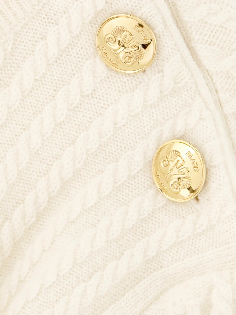 Close-up detail of the BLAZÉ Milano Highland Button-detailed Cable-knit Wool and Cashmere-blend Sweater