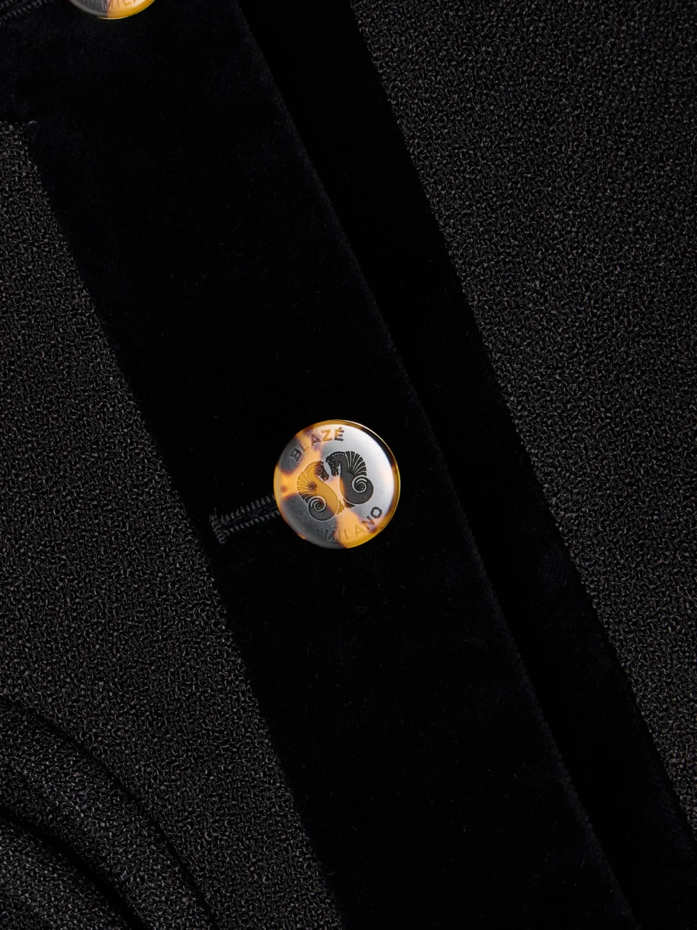 Close-up detail of the BLAZÉ Milano Spiti Cropped Cotton Velvet-trimmed Woven Jacket