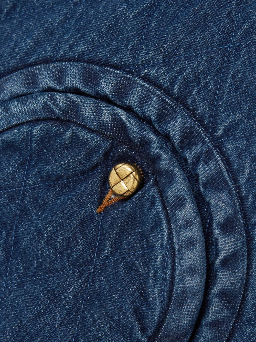 Close-up detail of the BLAZÉ Milano Suffolk Padded Quilted Denim Vest