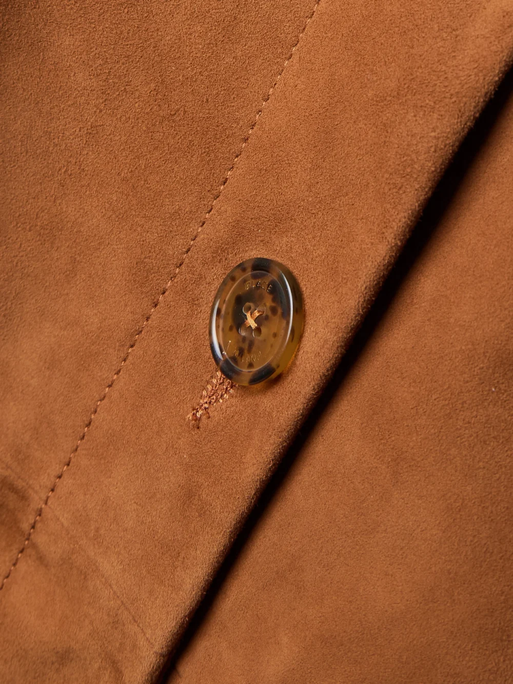 Close-up detail of the BLAZÉ Milano Viva Appaloosa Paneled Suede Midi Skirt