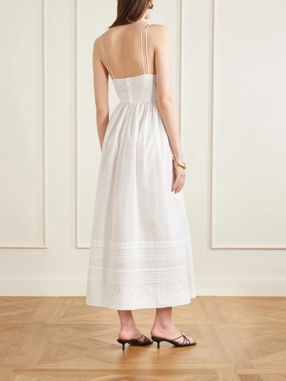 Back view of the Bode Chamomile Pintucked Embroidered Cotton-poplin Midi Dress