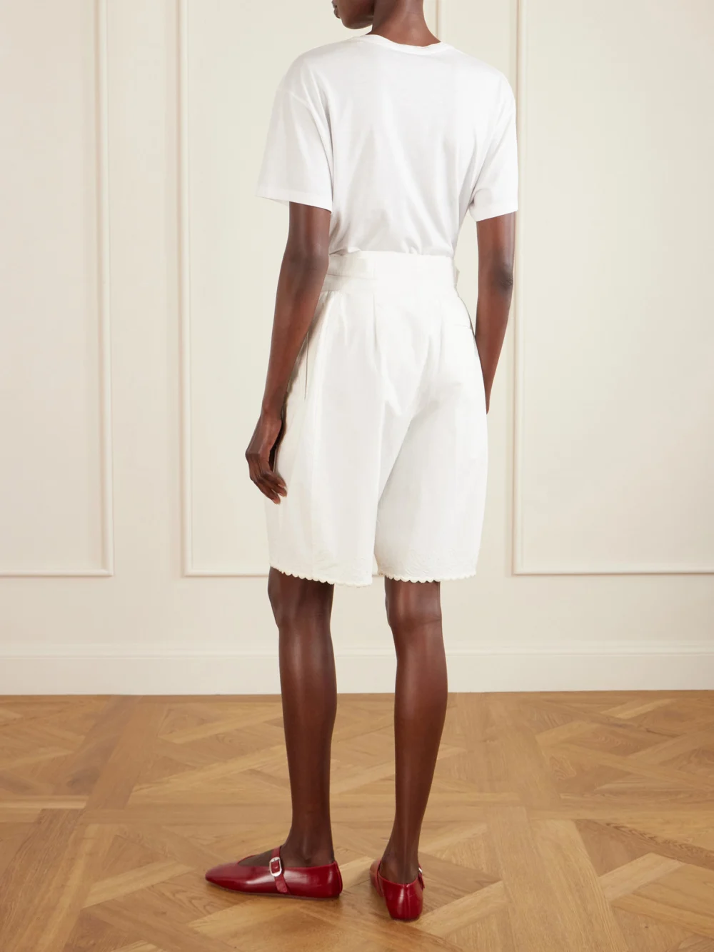Back view of the Bode Closerie Belted Scalloped Embroidered Cotton-poplin Shorts