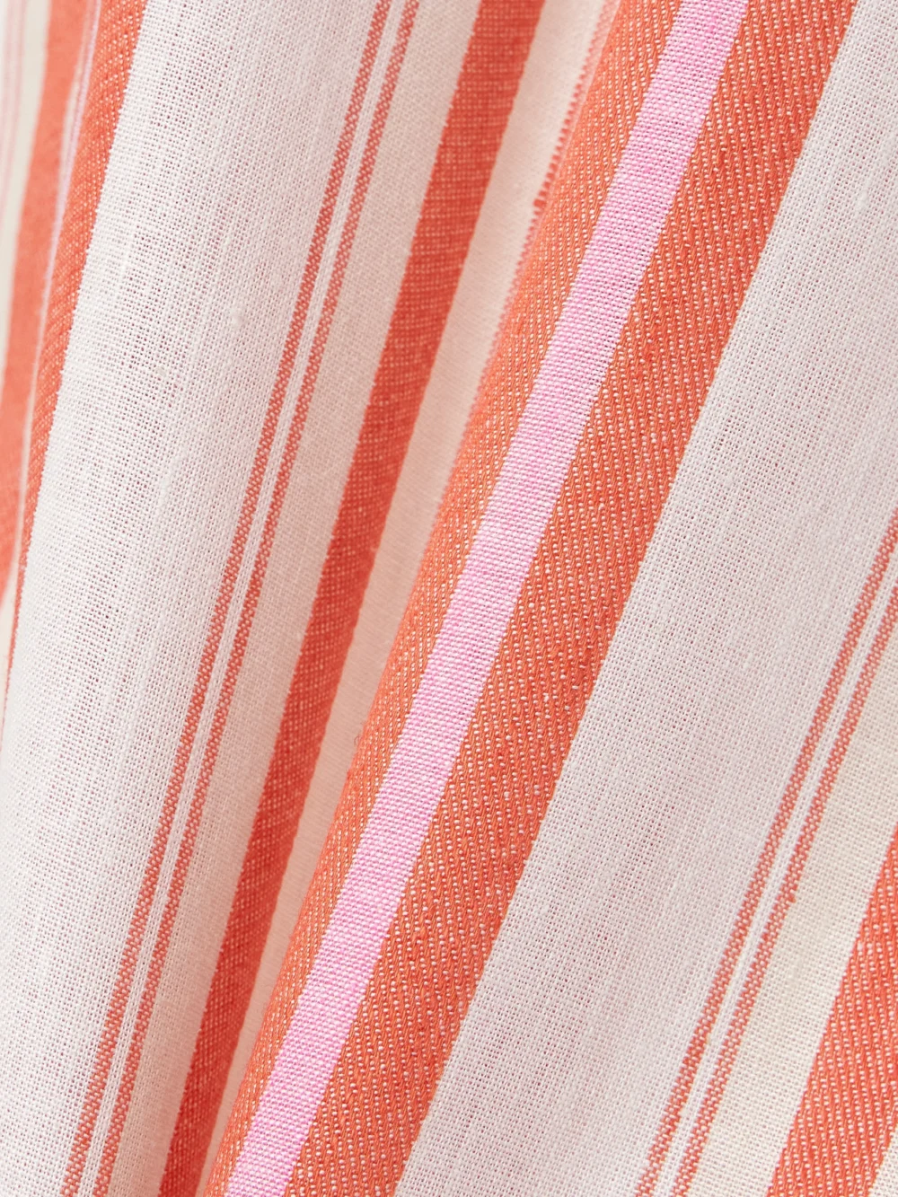 Close-up detail of the Bondi Born Arezzo Striped Organic Linen and Cotton-blend Midi Wrap Skirt