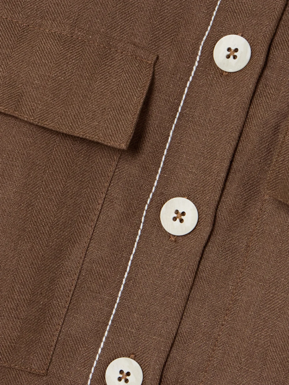 Close-up detail of the Bondi Born Varenna Cropped Herringbone Organic Linen Vest