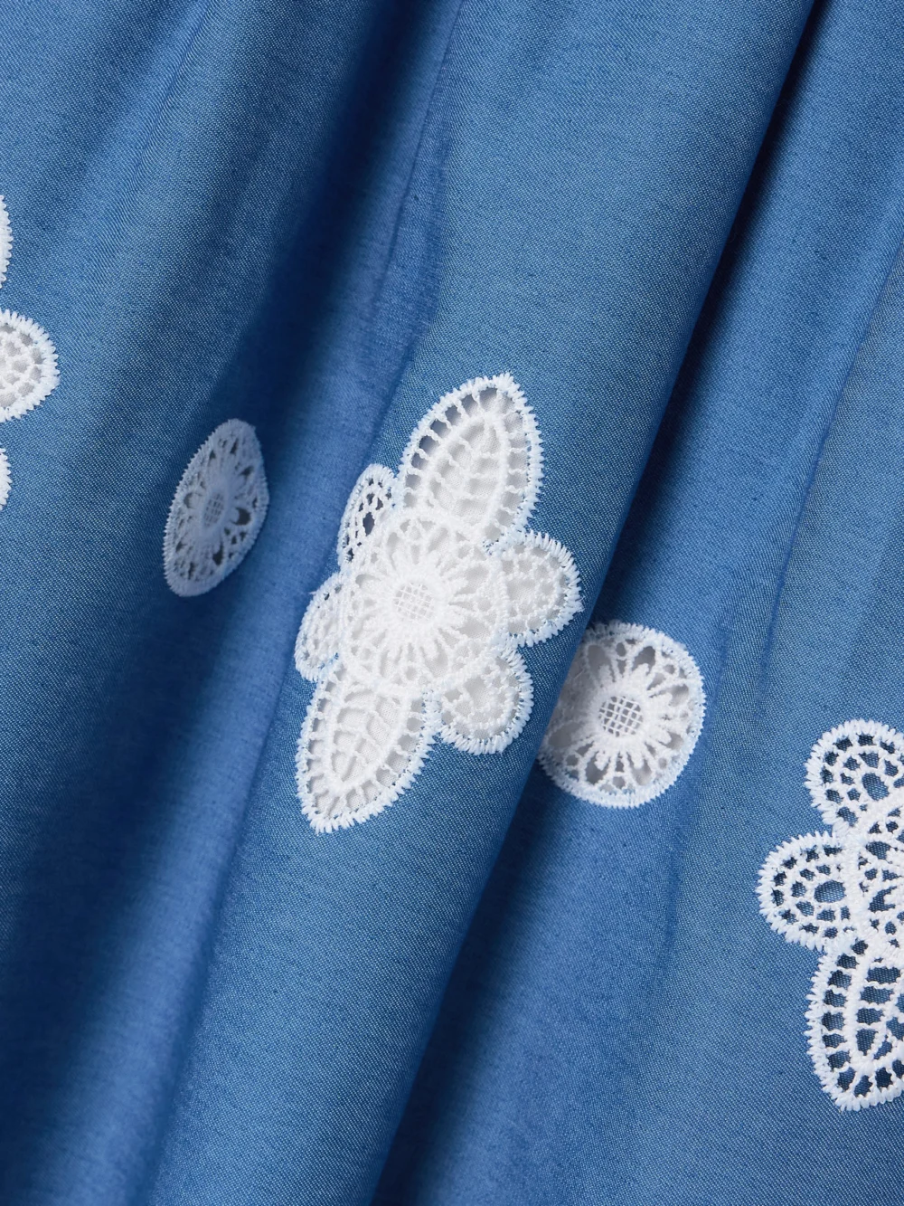 Close-up detail of the Borgo de Nor Rhea Crocheted Lace-trimmed Chambray Midi Skirt