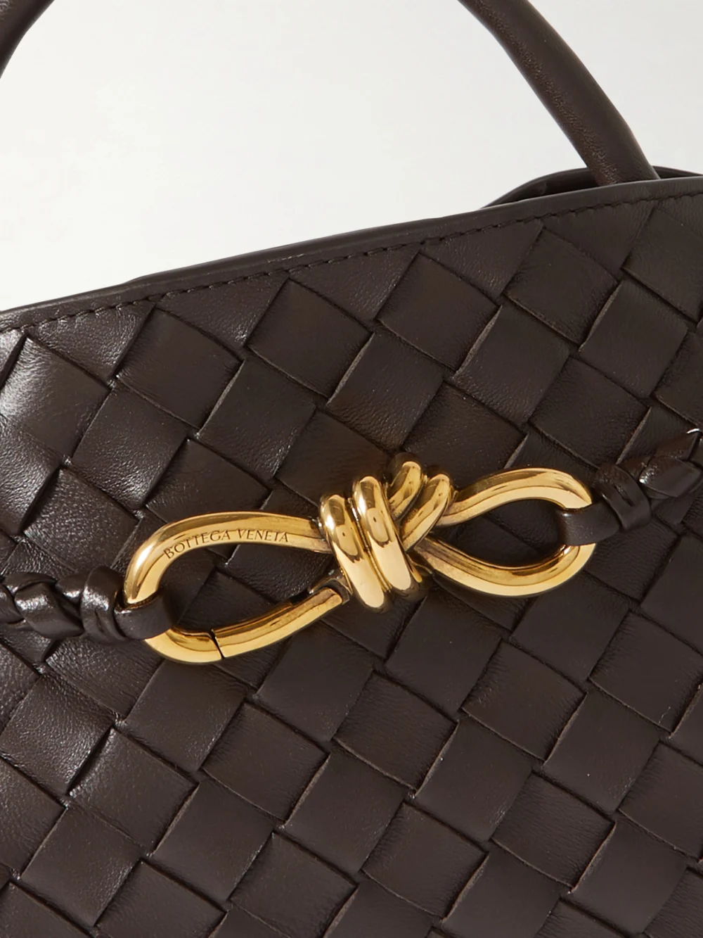 Close-up detail of the Bottega Veneta Andiamo East-west Small Intrecciato Leather Top-handle Bag