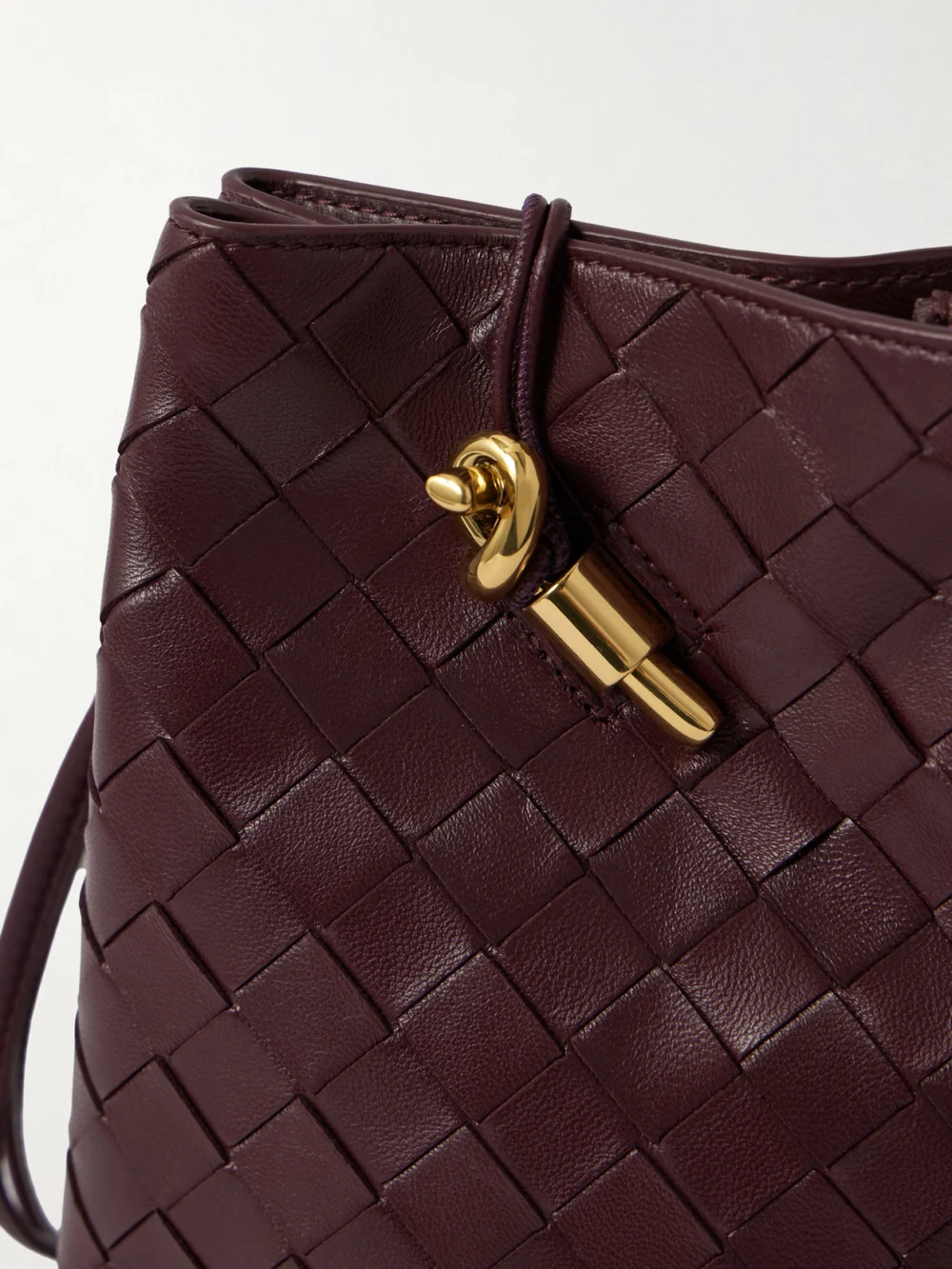 Close-up detail of the Bottega Veneta Andiamo Intrecciato Leather Phone Pouch
