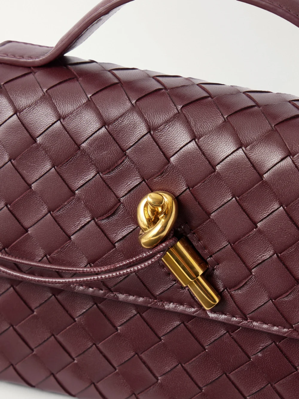 Close-up detail of the Bottega Veneta Andiamo Intrecciato Leather Top-handle Bag