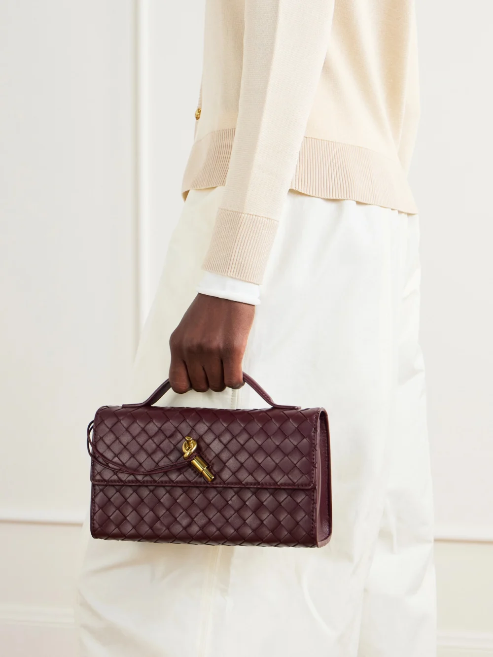 Bottega Veneta Andiamo Intrecciato Leather Top-handle Bag, styled view
