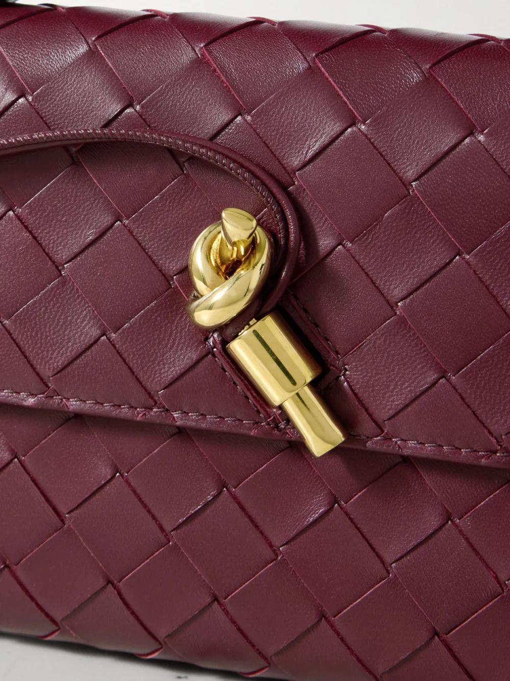 Close-up detail of the Bottega Veneta Andiamo Long Intrecciato Leather Clutch