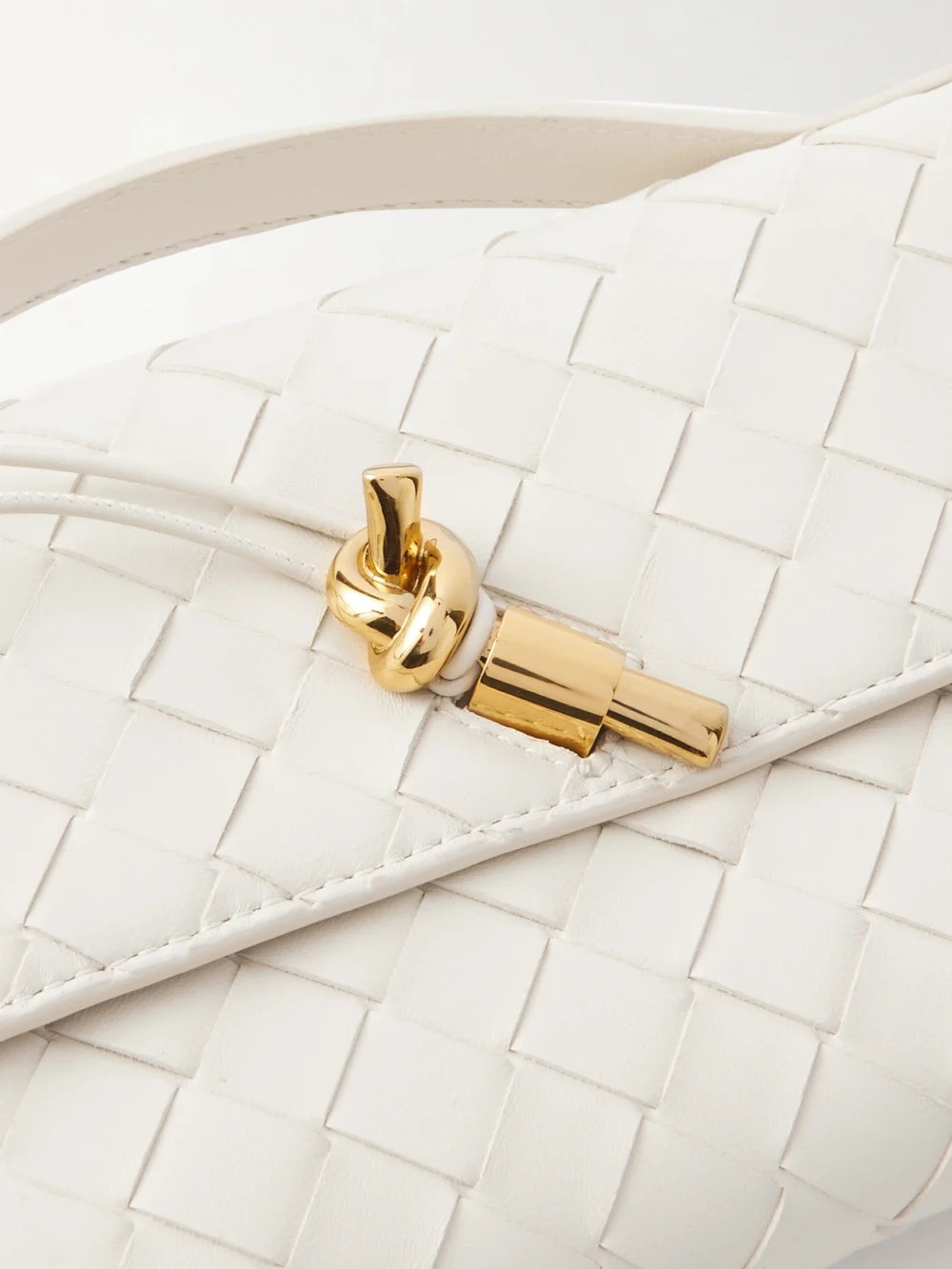 Close-up detail of the Bottega Veneta Andiamo Long Intrecciato Leather Clutch