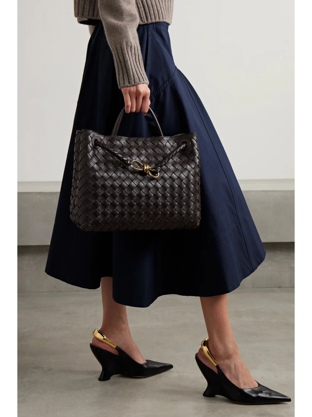 Bottega Veneta Andiamo Medium Intrecciato Leather Top-handle Bag, styled view