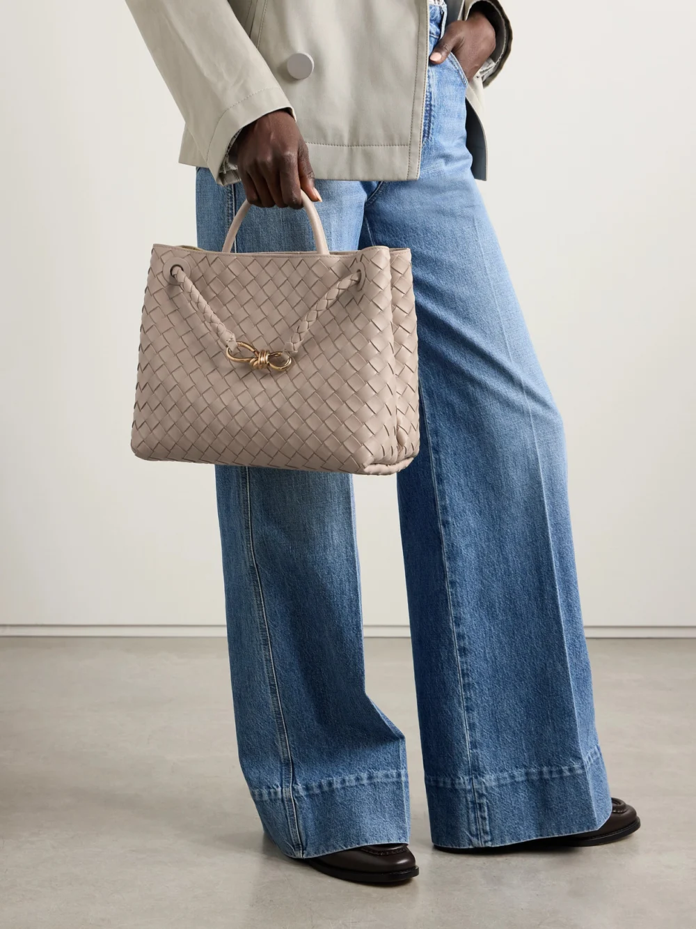 Bottega Veneta Andiamo Medium Intrecciato Leather Top-handle Bag, styled view